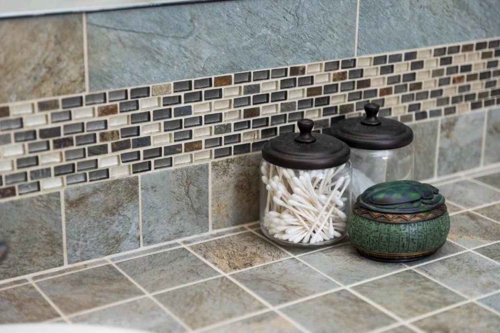 Custom slate tile countertop detail with mosaic accent border