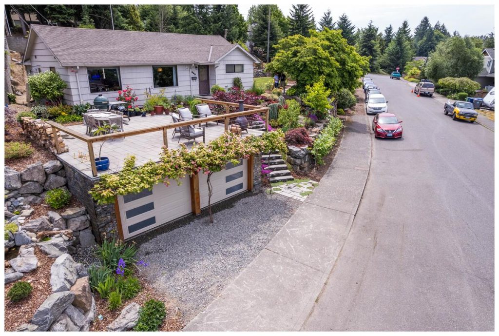 Street view of Renton home with front deck and terraced landscaping