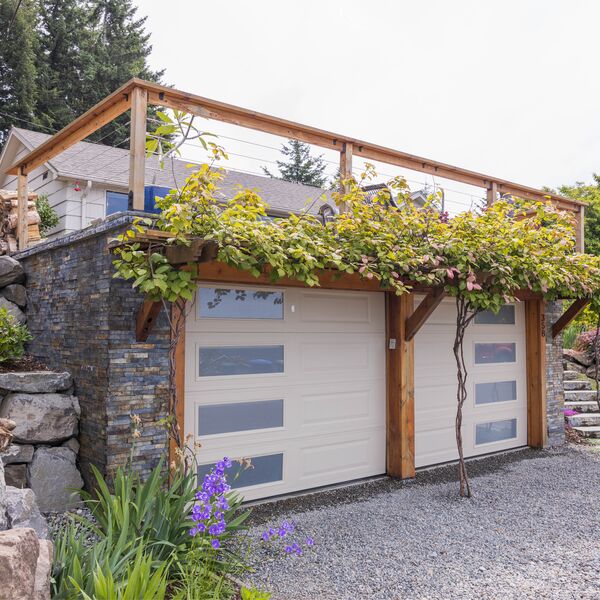 Custom western red cedar arbor with stone accents