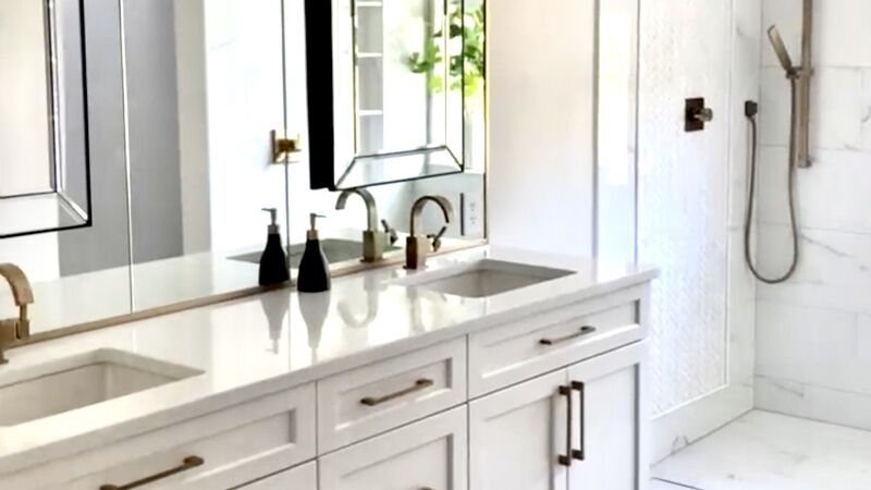Modern bathroom remodel with double vanity and walk-in shower